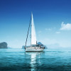 Lean sailboat in blue, protected waters with just the mainsail up